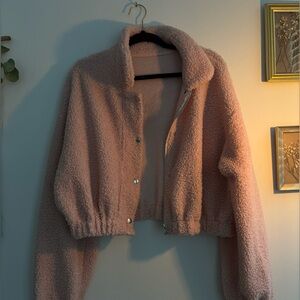 Light pink fuzzy jacket.